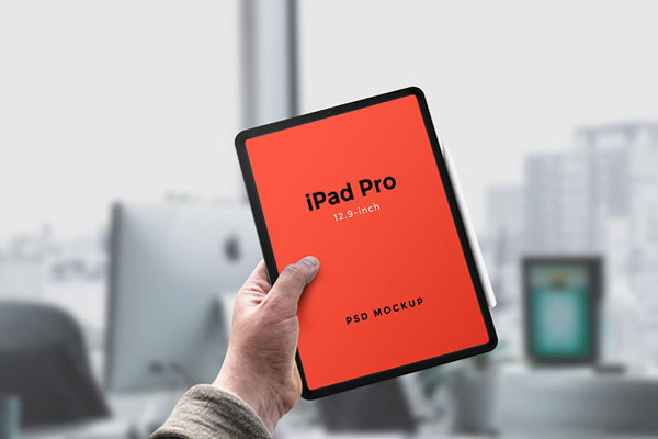 iPad Pro with Apple Pencil Held by a Hand PSD Mockup FREE PSD