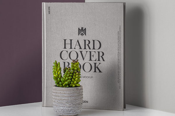 Vertical Hardcover Book Placed Behind a Flowerpot FREE PSD
