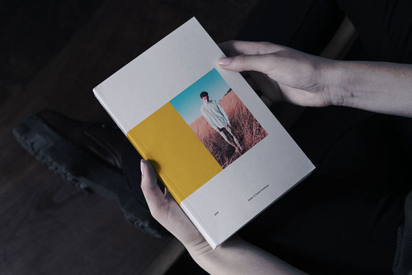 Book In Hand Mockup From Birds Eye View FREE PSD
