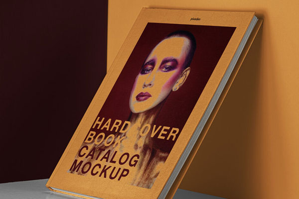 Free Hardcover Book Catalog Mockup Relying On wall FREE PSD