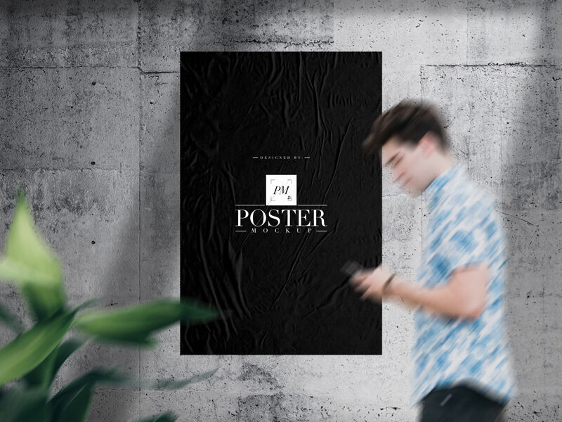 Mockup Displaying Glued Paper on Concrete Wall with Blurry Guy and Plant FREE PSD