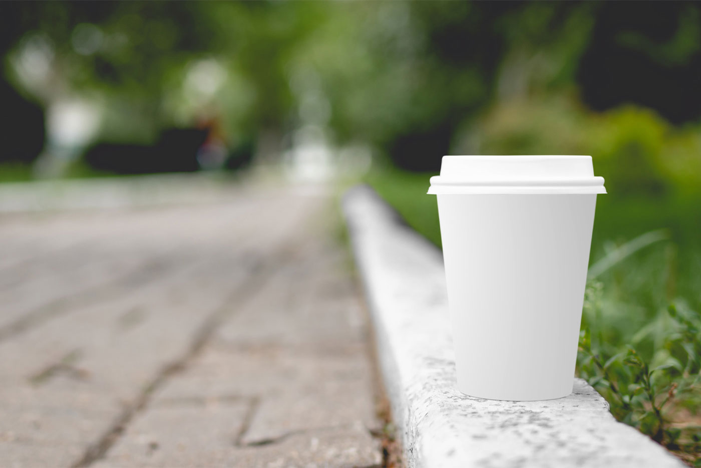 Mockup Featuring a Coffee Cup Placed on the Sidewalk FREE PSD