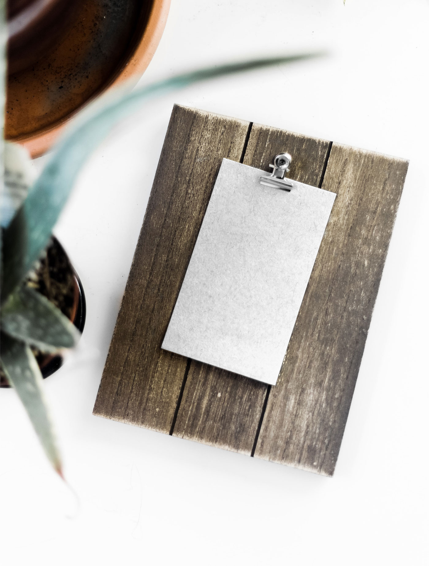 Mockup Featuring Overhead View of Card on Wooden Board FREE PSD