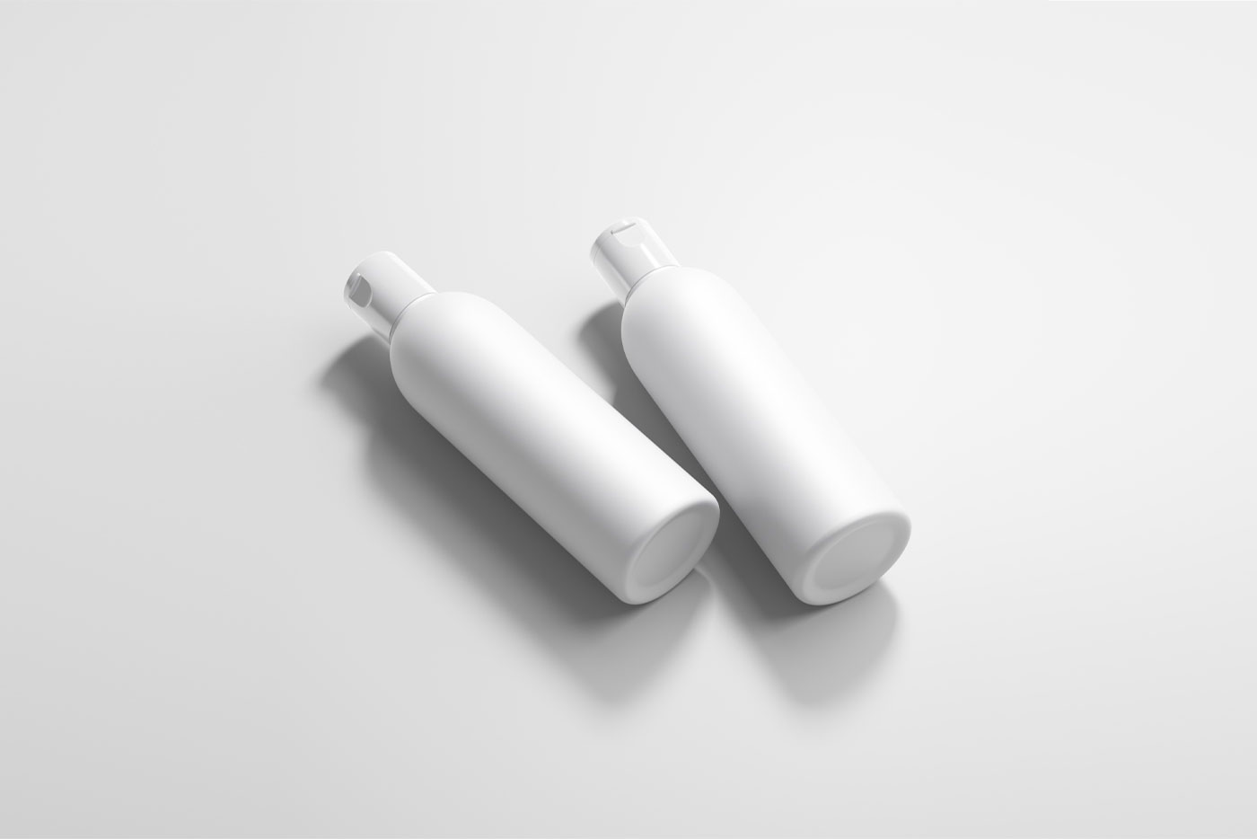 Mockup of Two Lying Cosmetic Bottles FREE PSD