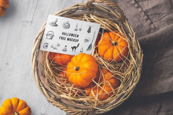 Mockup Showing Halloween Card on a Basket Filled with Tiny Pumpkins FREE PSD