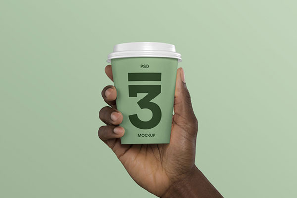 Mockup Showing Hand Holding Coffee Cup Wearing Lid FREE PSD