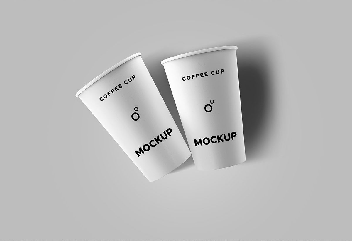 Two Coffee Cups Lying on a Flat Surface Mockup FREE PSD