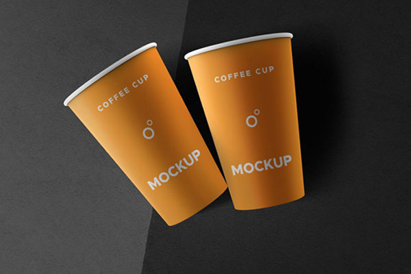 Two Coffee Cups Lying on a Flat Surface Mockup FREE PSD