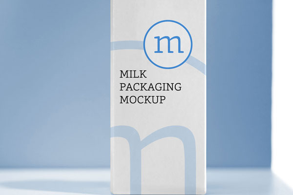 Vertical Milk Packaging Mockup on a Table FREE PSD