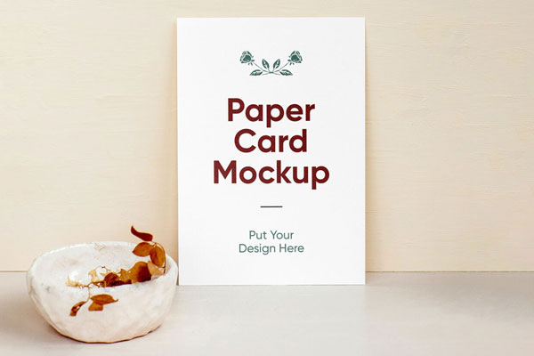 A4 Paper against Wall beside a Bowl Containing Dried Leaves Mockup FREE PSD