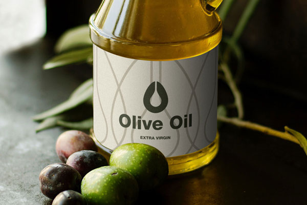 Bottle Of Olive Oil With Olives In The Background Mockup FREE PSD