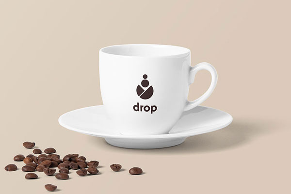Coffee Cup Decorated with Poured Coffee Beans Mockup FREE PSD