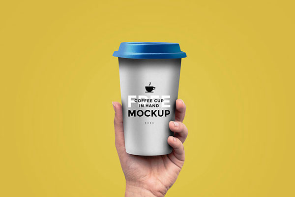 Coffee Cup Held in Hand Mockup FREE PSD