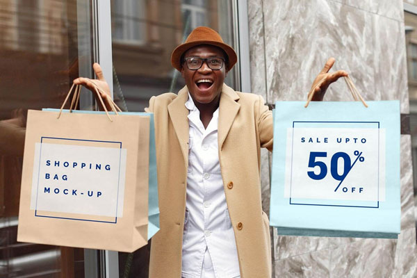 Excited Man Holding Shopping Bags Mockup FREE PSD