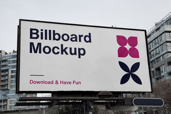 Front View of a City Billboard in front of Modern Buildings FREE PSD