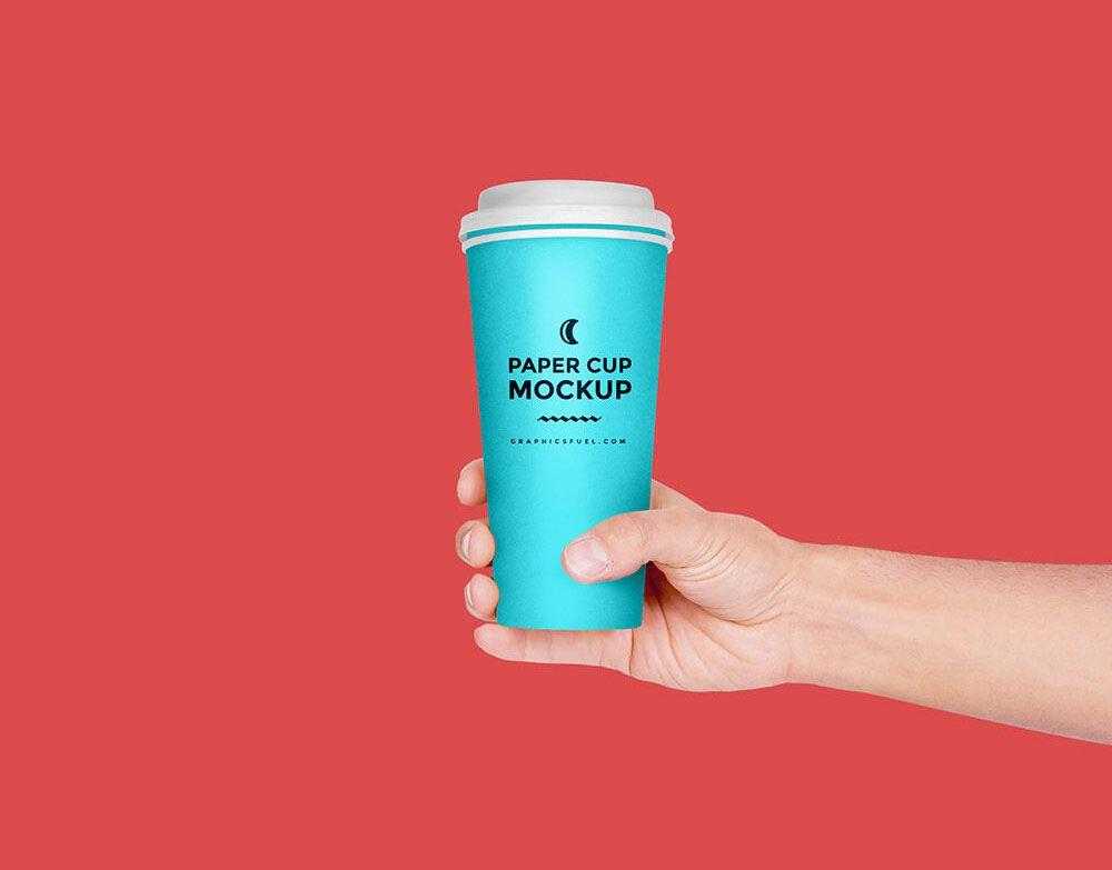 Hand Holding Paper Coffee Cup Mockup FREE PSD