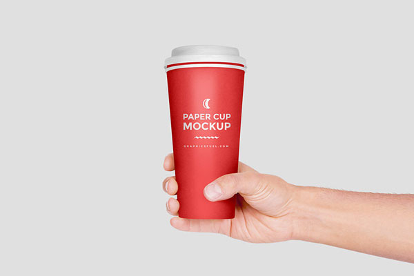 Hand Holding Paper Coffee Cup Mockup FREE PSD