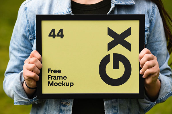 Horizontal Frame Held by a woman PSD Mockup FREE PSD