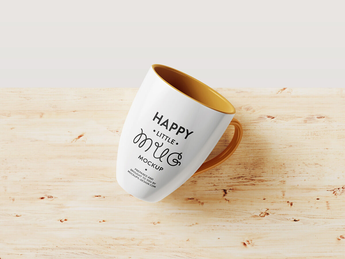 Laid-down Mug Mockup On A wooden Background FREE PSD
