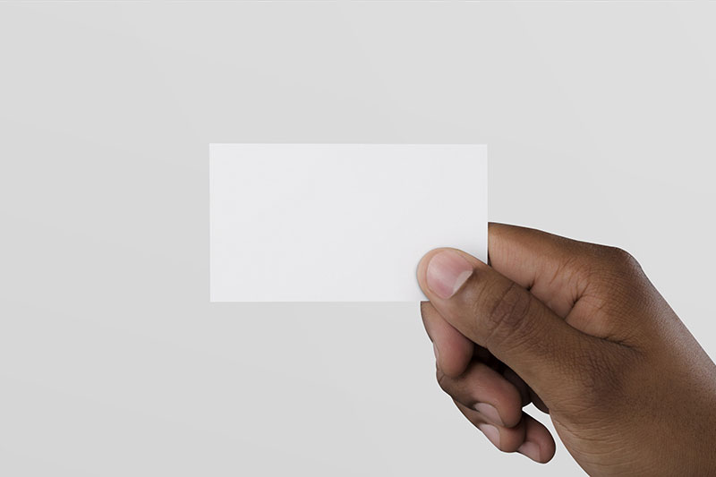 Mockup a Man's Hand Holding a Business Card FREE PSD