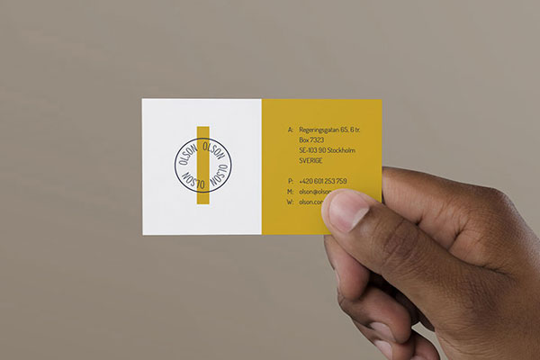 Mockup a Man's Hand Holding a Business Card FREE PSD