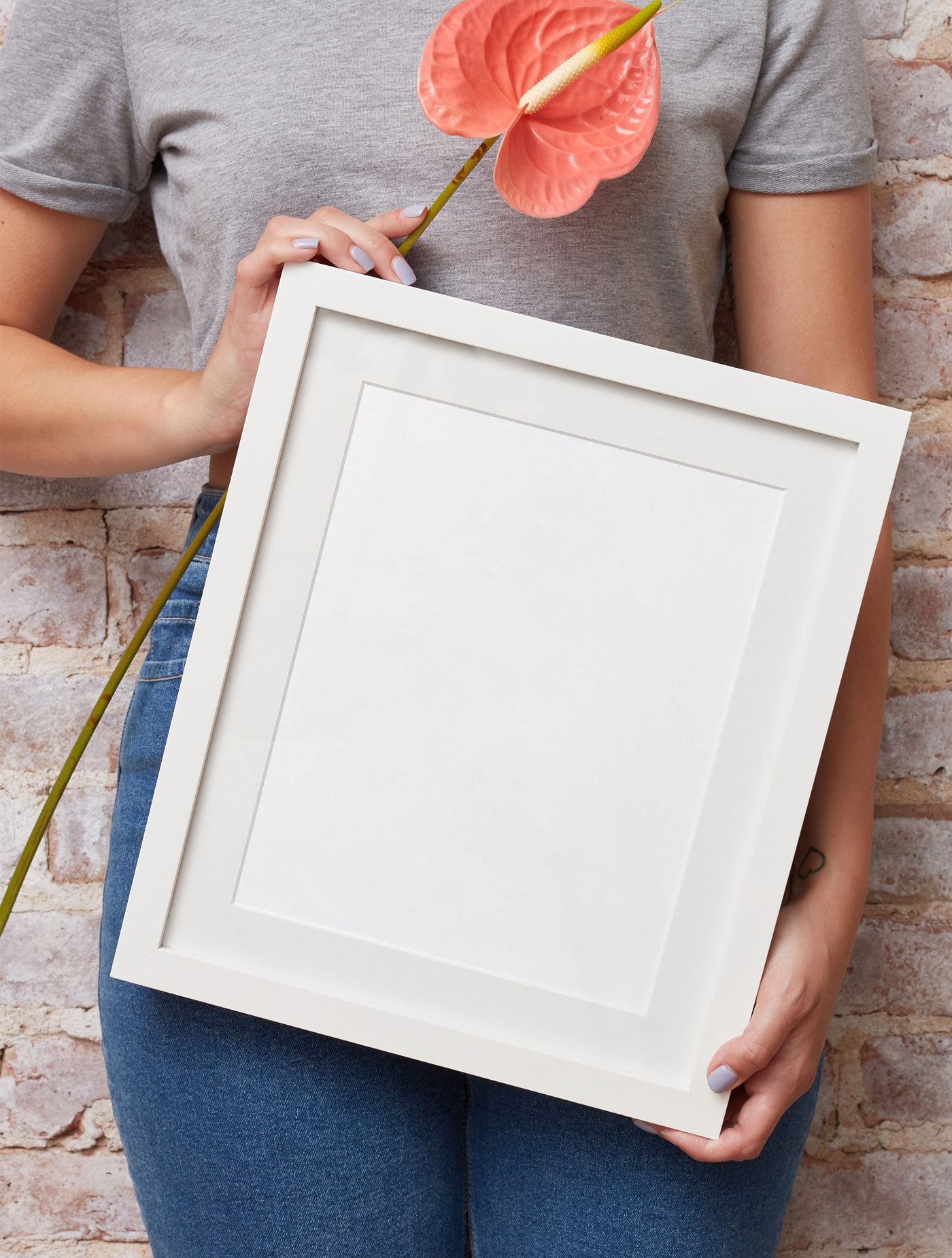 Mockup Displaying a Girl Holding Frame and Flower FREE PSD