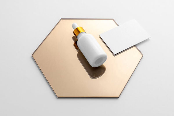 Mockup Displaying Dropper Bottle and Business Card on a Hexagon Mirror FREE PSD