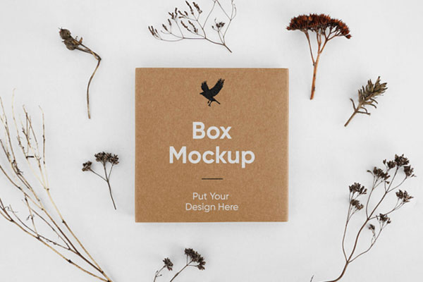 Mockup Displaying Small Box Top View Decorated with Dried Flowers FREE PSD