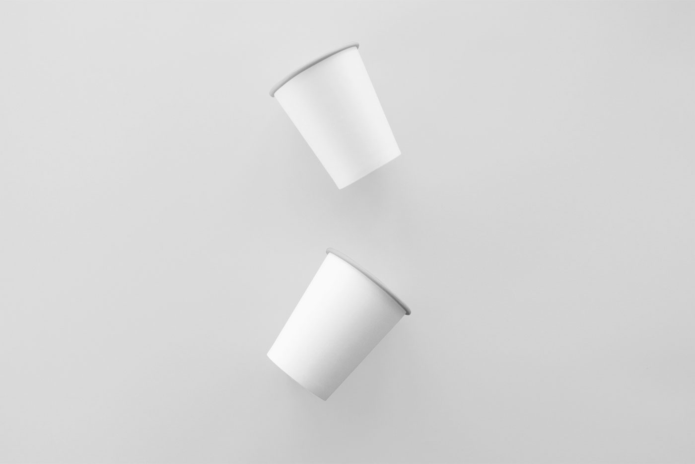 Mockup Displaying Two Floating Coffee Paper Cups FREE PSD