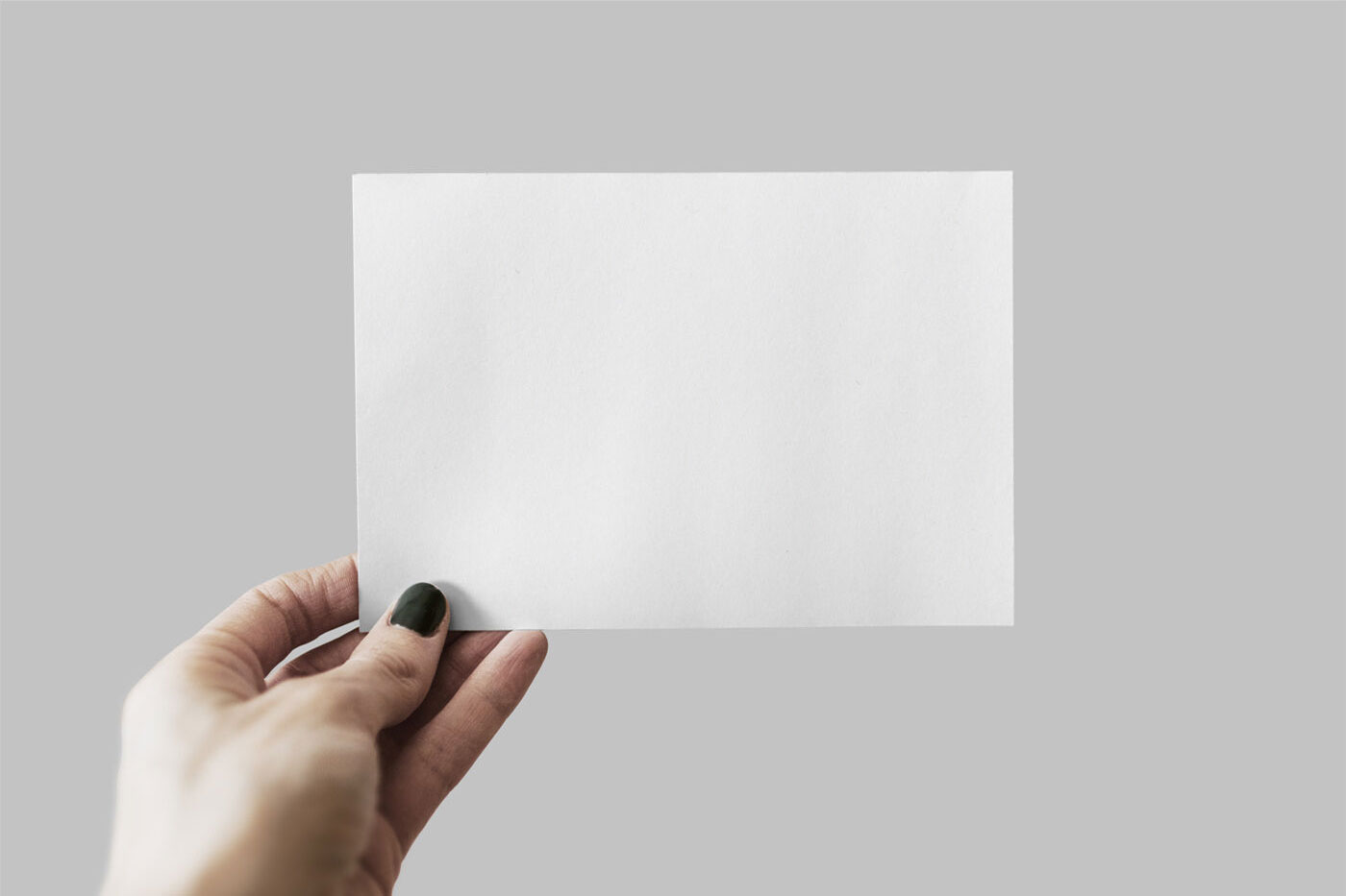 Mockup Featuring a Hand Holding Postcard FREE PSD