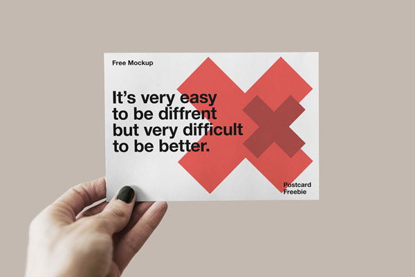 Mockup Featuring a Hand Holding Postcard FREE PSD