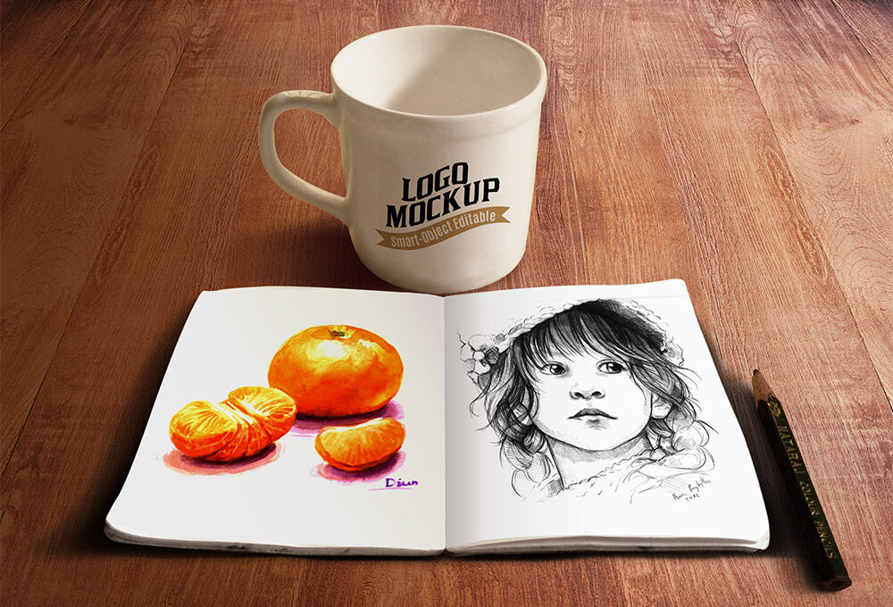 Mockup Featuring a Simple Mug and a Sketchbook FREE PSD