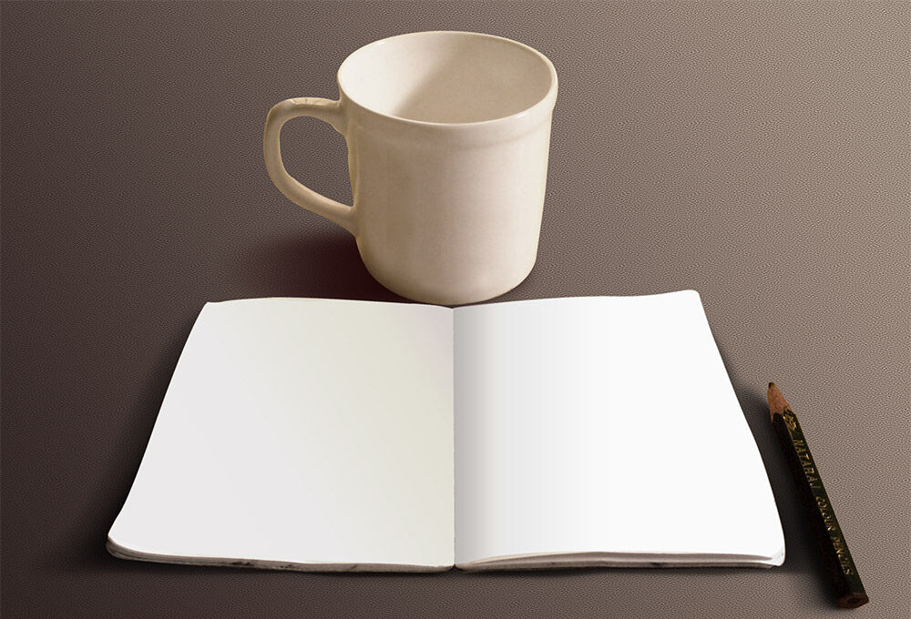 Mockup Featuring a Simple Mug and a Sketchbook FREE PSD