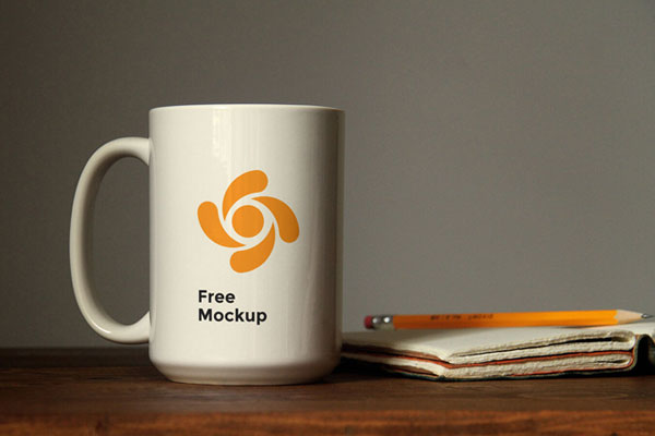 Mockup Featuring Front View of a Coffee Mug on a Wooden Table FREE PSD