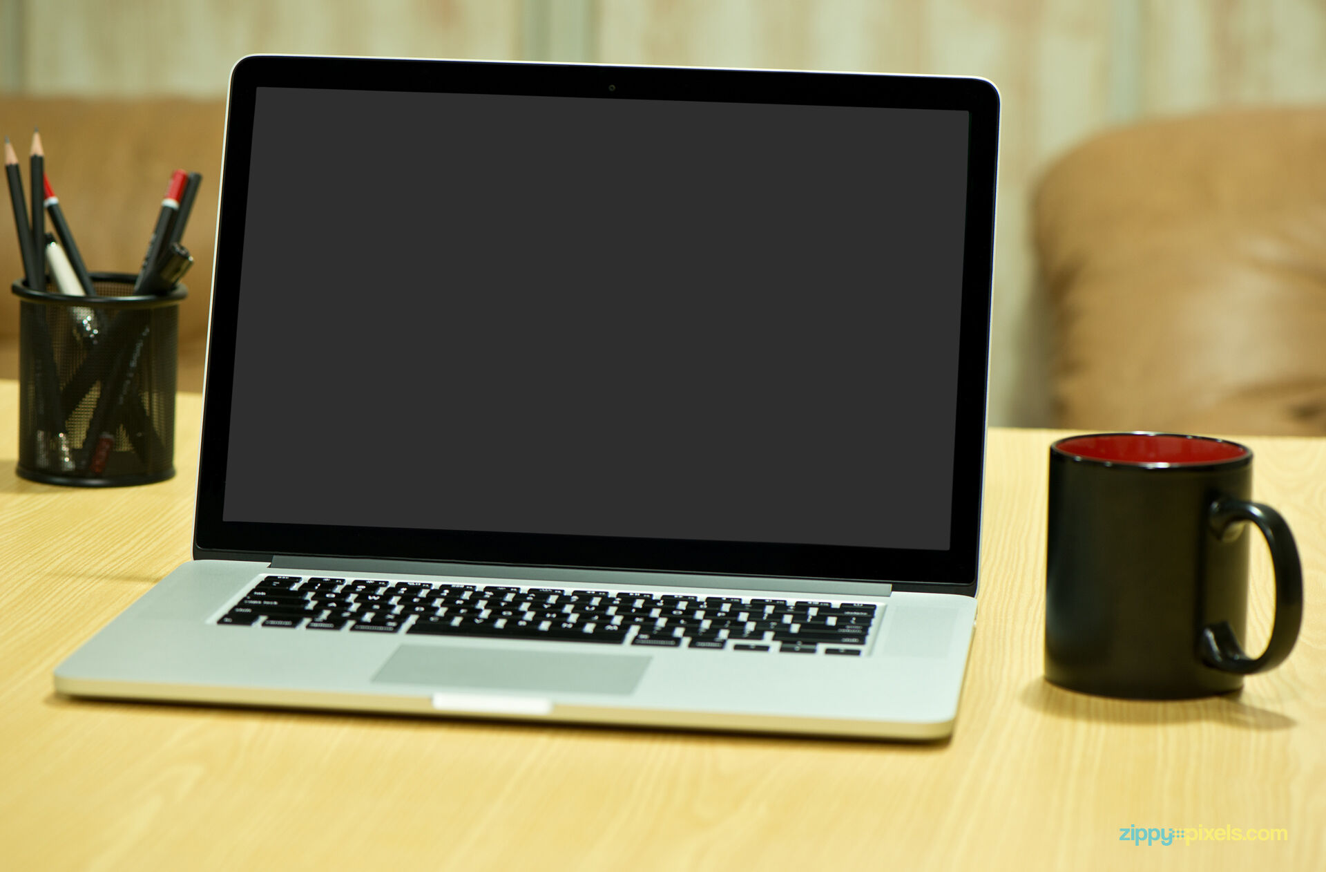 Mockup Featuring MacBook Pro on Wooden Table FREE PSD