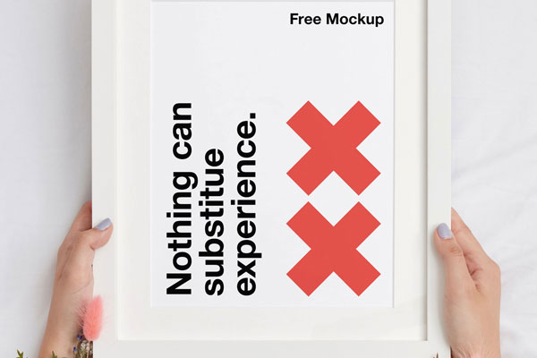 Mockup Featuring Overhead View of Hand Holding Frame FREE PSD