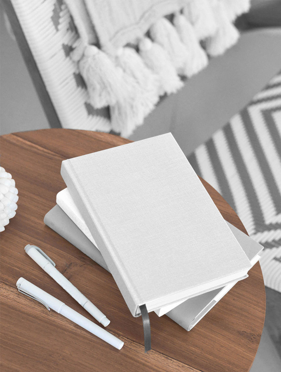 Mockup Featuring Three Hardcover Books on Wooden Table FREE PSD