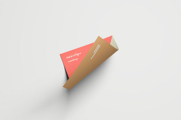 Mockup Featuring Top View of Curled Flyer FREE PSD