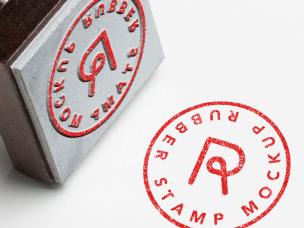 Mockup Of a Diagonal Rubber Stamp on a Sheet of Paper FREE PSD