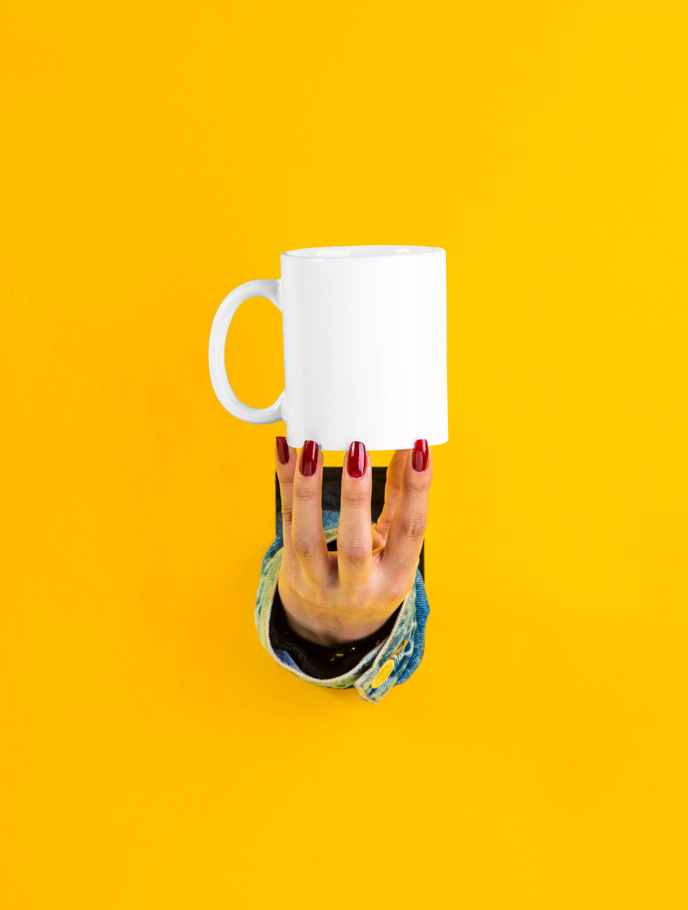 Mockup of a Female Hand Holding a Cup FREE PSD