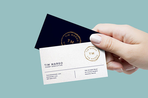 Mockup of a Hand Holding Two Business Cards FREE PSD