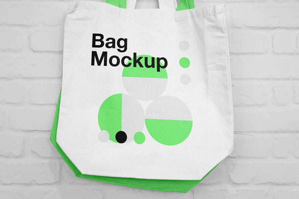Mockup of Two Canvas Bags Hanging on a Nail FREE PSD