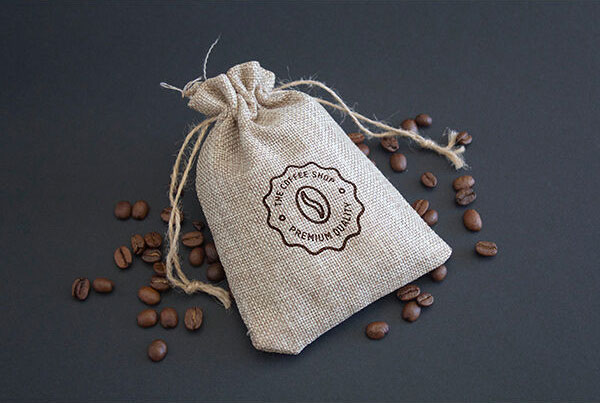 Mockup Showcasing Coffee Branding and Label on Cup and Sack FREE PSD