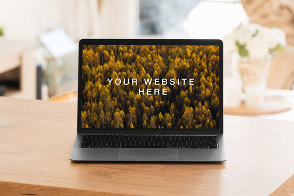 Opened MacBook In A Interior Environment Mockup FREE PSD