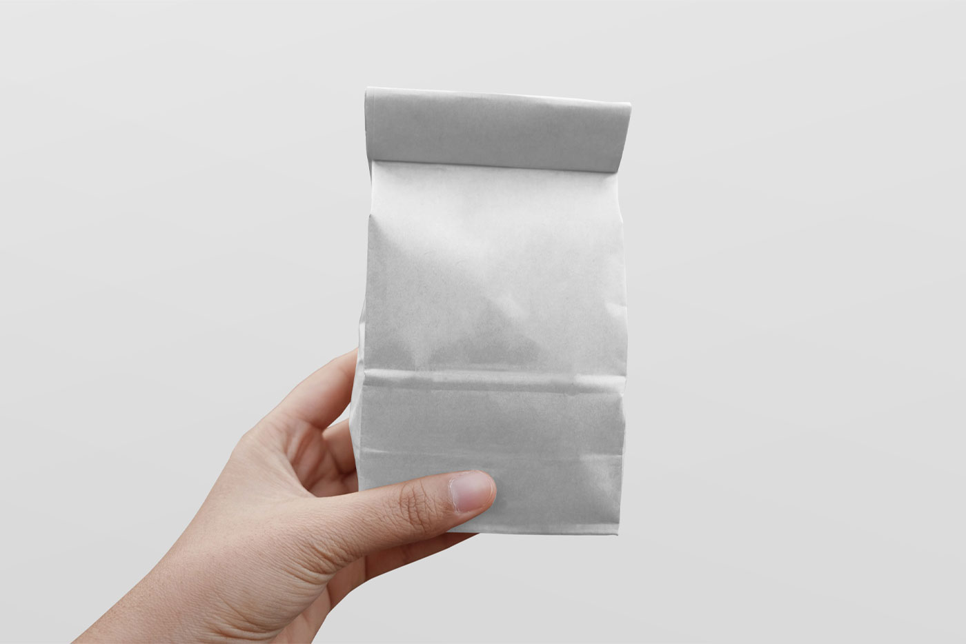 Paper Coffee Bag Mockup In Hand FREE PSD