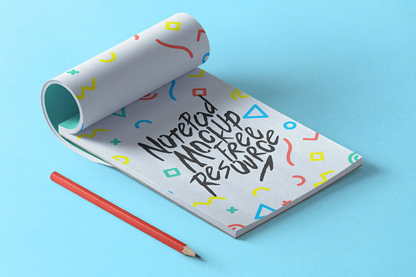 Partly Rolled Notepad Mockup with a pen FREE PSD