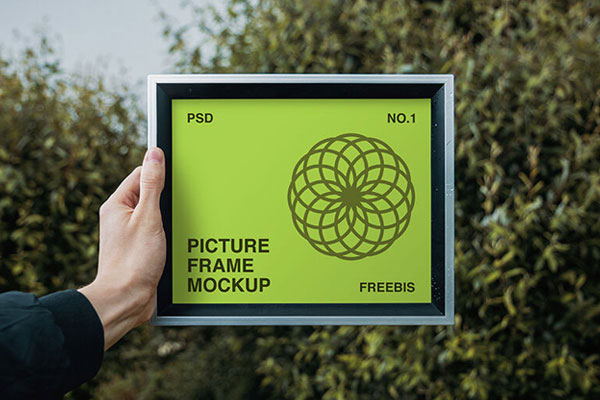 Picture Frame Mockup In Hand FREE PSD