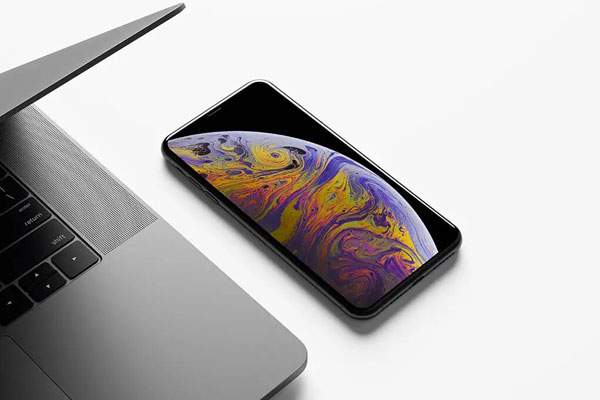 Realistic iPhone Xs Max Mockup next to a Macbook FREE PSD