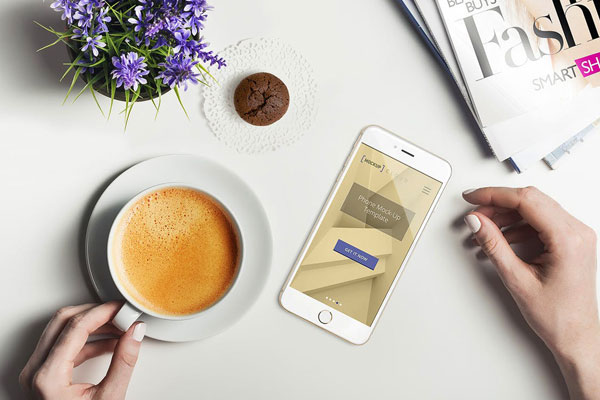 Smartphone Top View in a Hand Holding Cup Setting Mockup FREE PSD