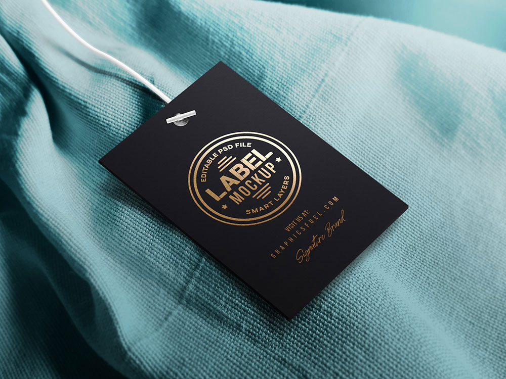 Tag Label Lying on a Piece of Cloth Mockup FREE PSD